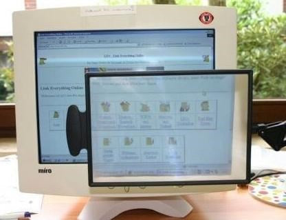 Table-top magnifier mounted on the tabletop