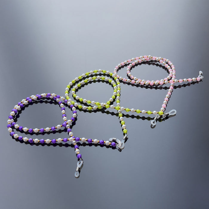 A chain for glasses, beads, an orange pendant