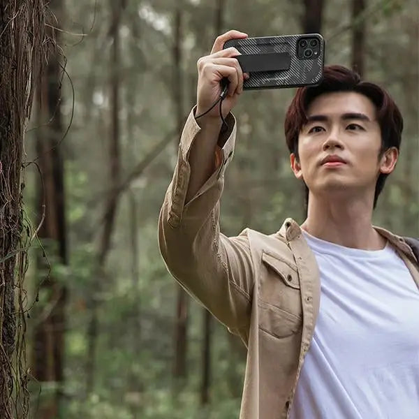 Uniq Heldro case for iPhone 12 / iPhone 12 Pro - black camouflage - Cell phone cases and covers<<<HurtelXML